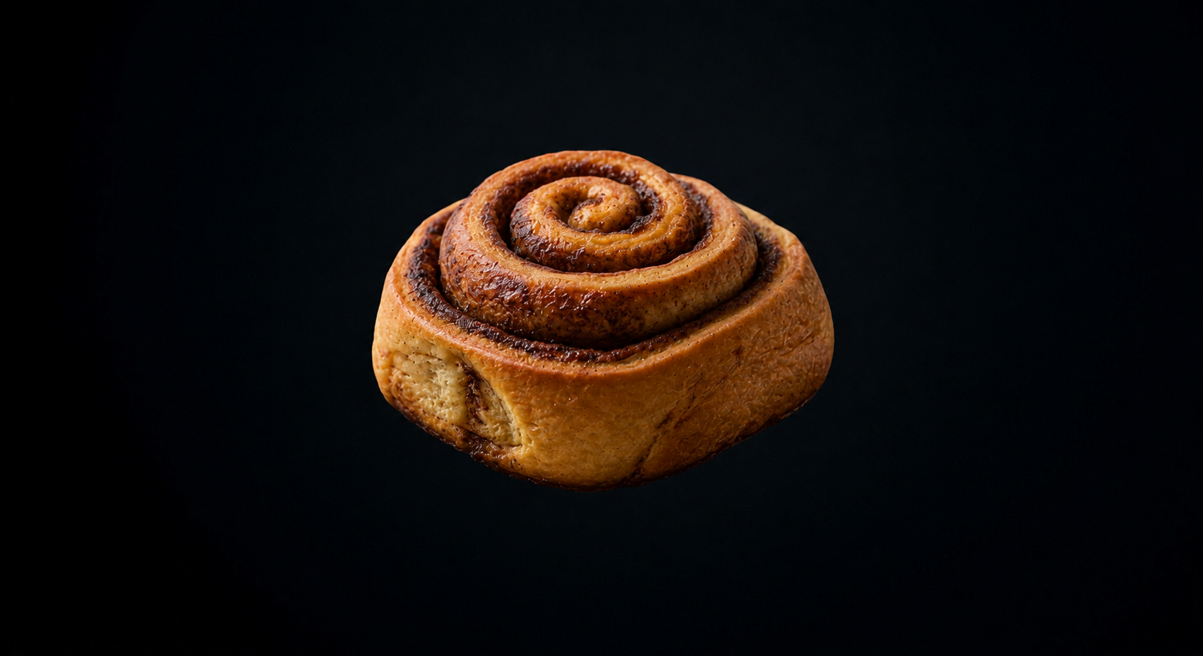 Close-up of a golden cinnamon roll